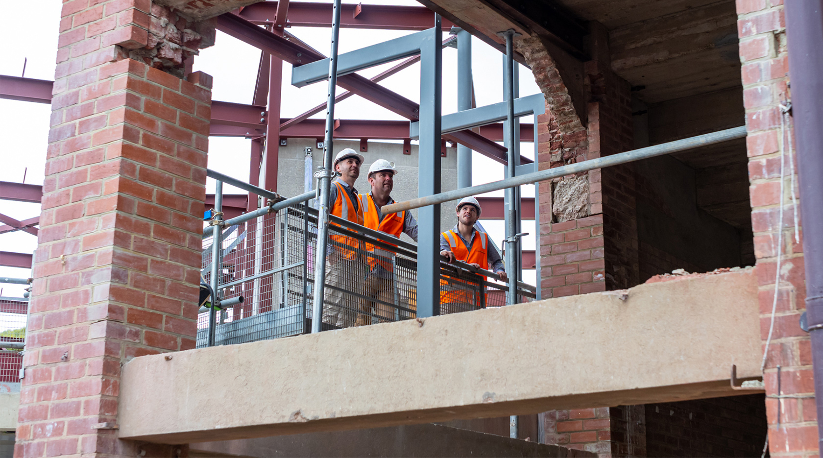 schiavello adelaide construction staff on construction site wearing hi visibility vests