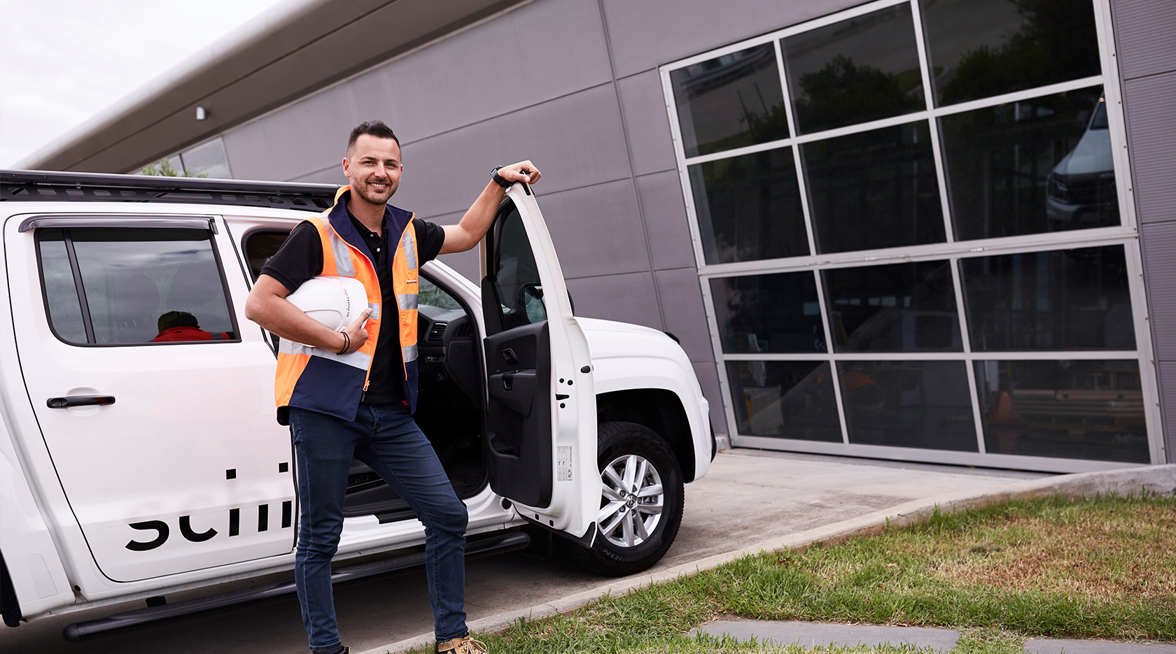 schiavello construction staff member standing in front of white ute