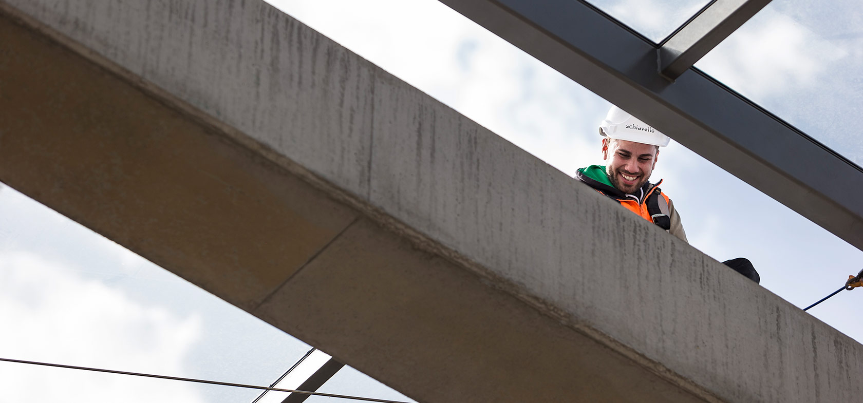 Schiavello employee construction site sitting on concrete beam at village belle hotel