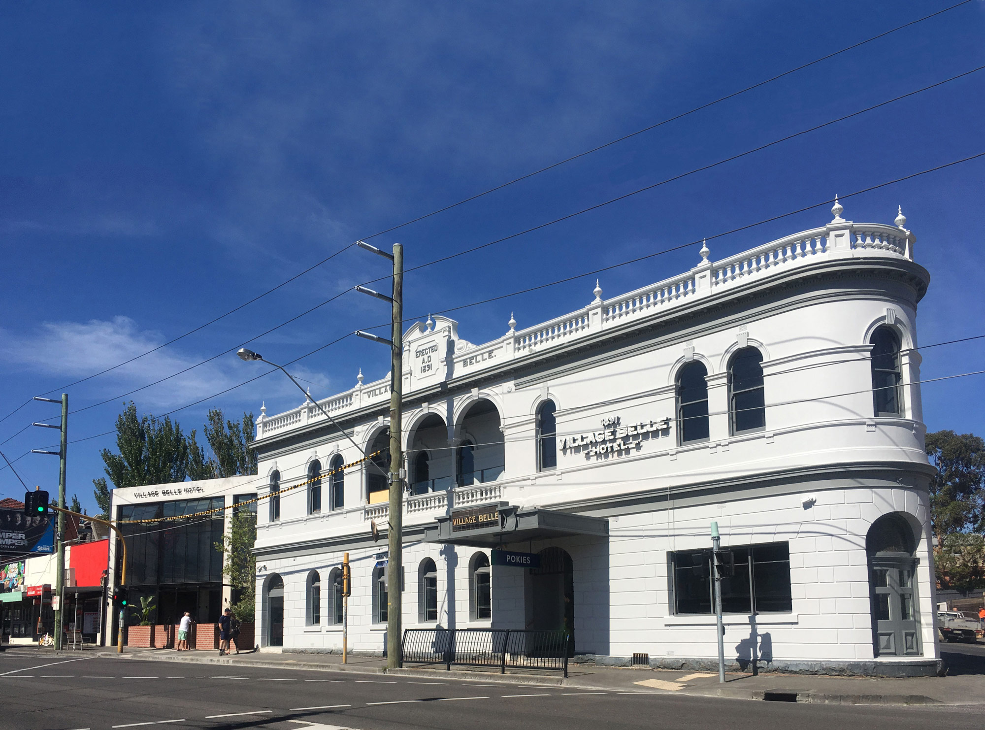 village belle hotel exterior building painted white refurbished