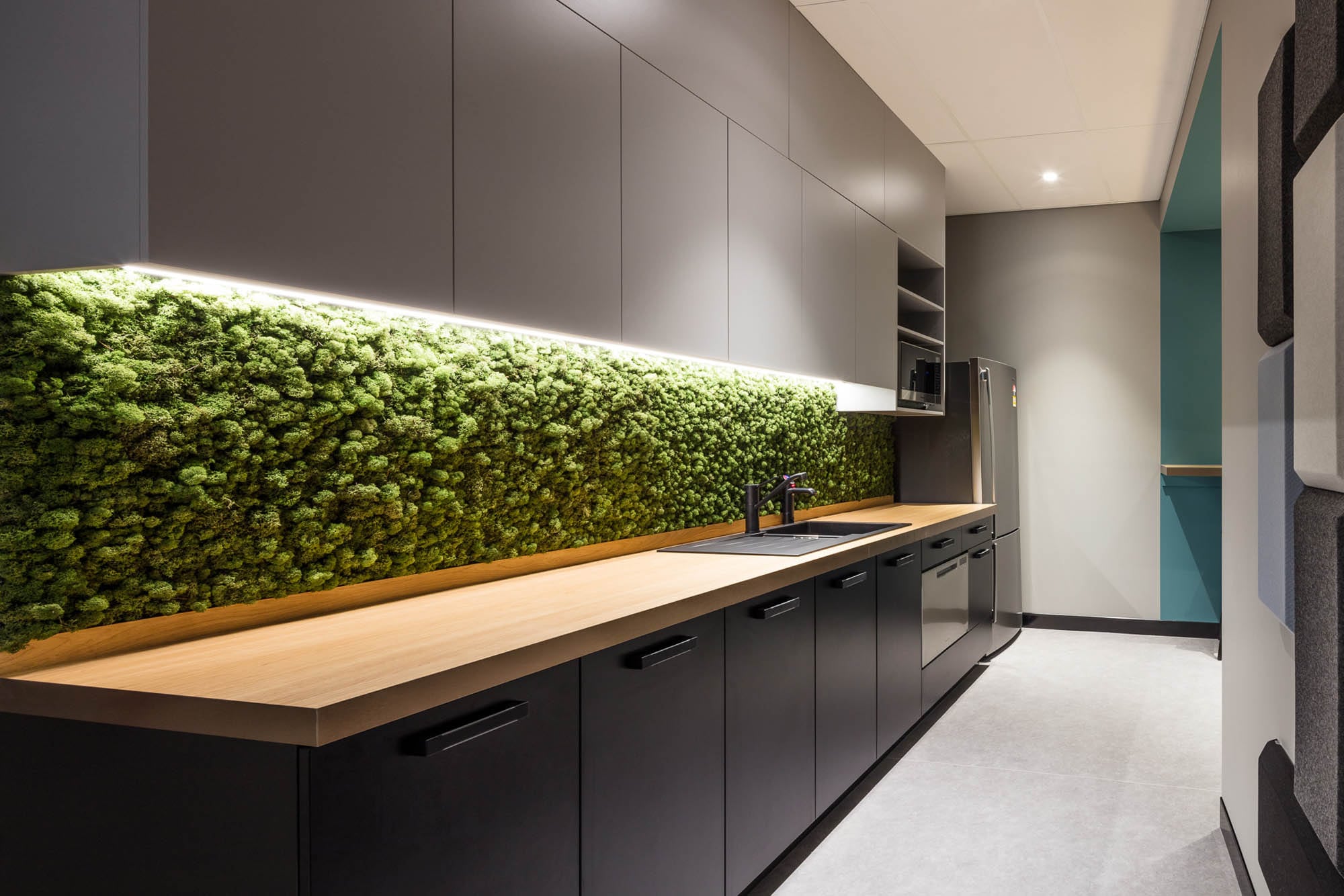 cbus office kitchen with faux green wall