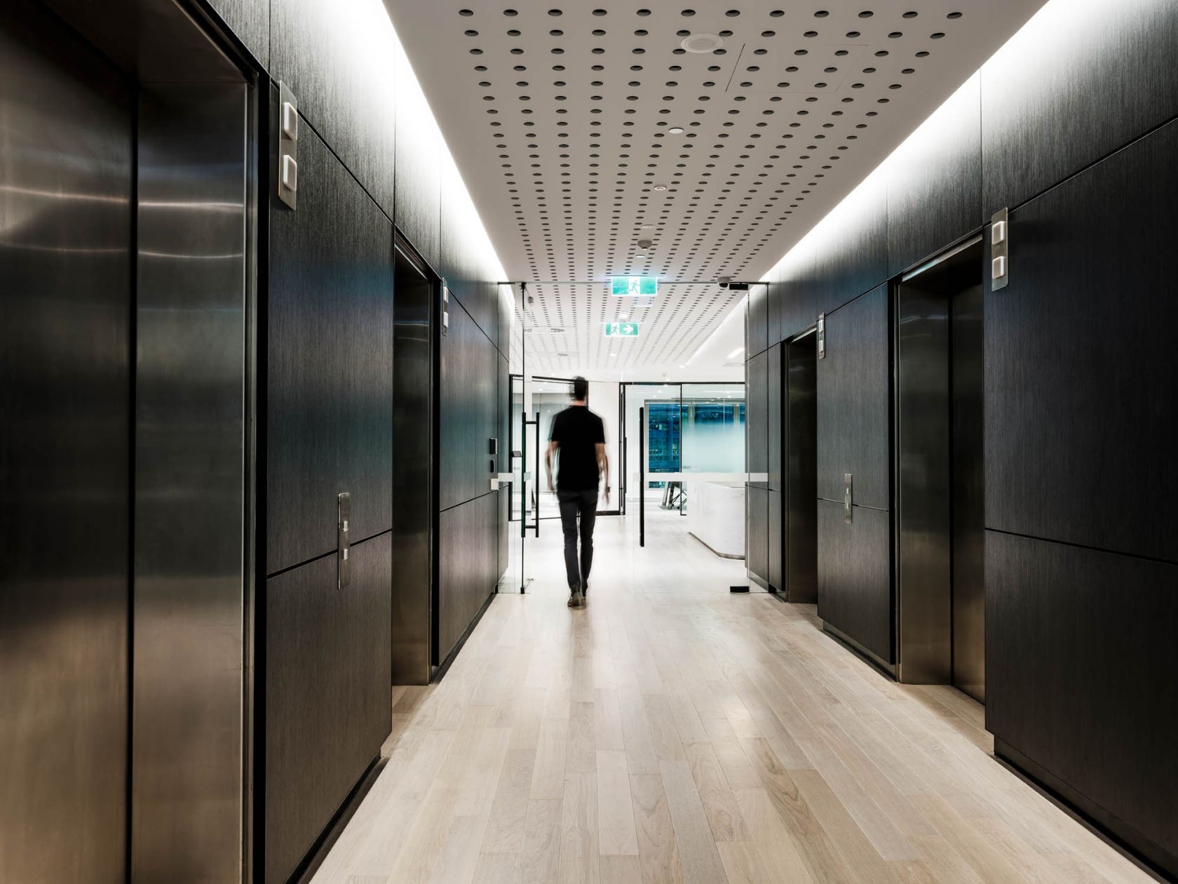 broadspectrum office elevator lobby with black timber walls