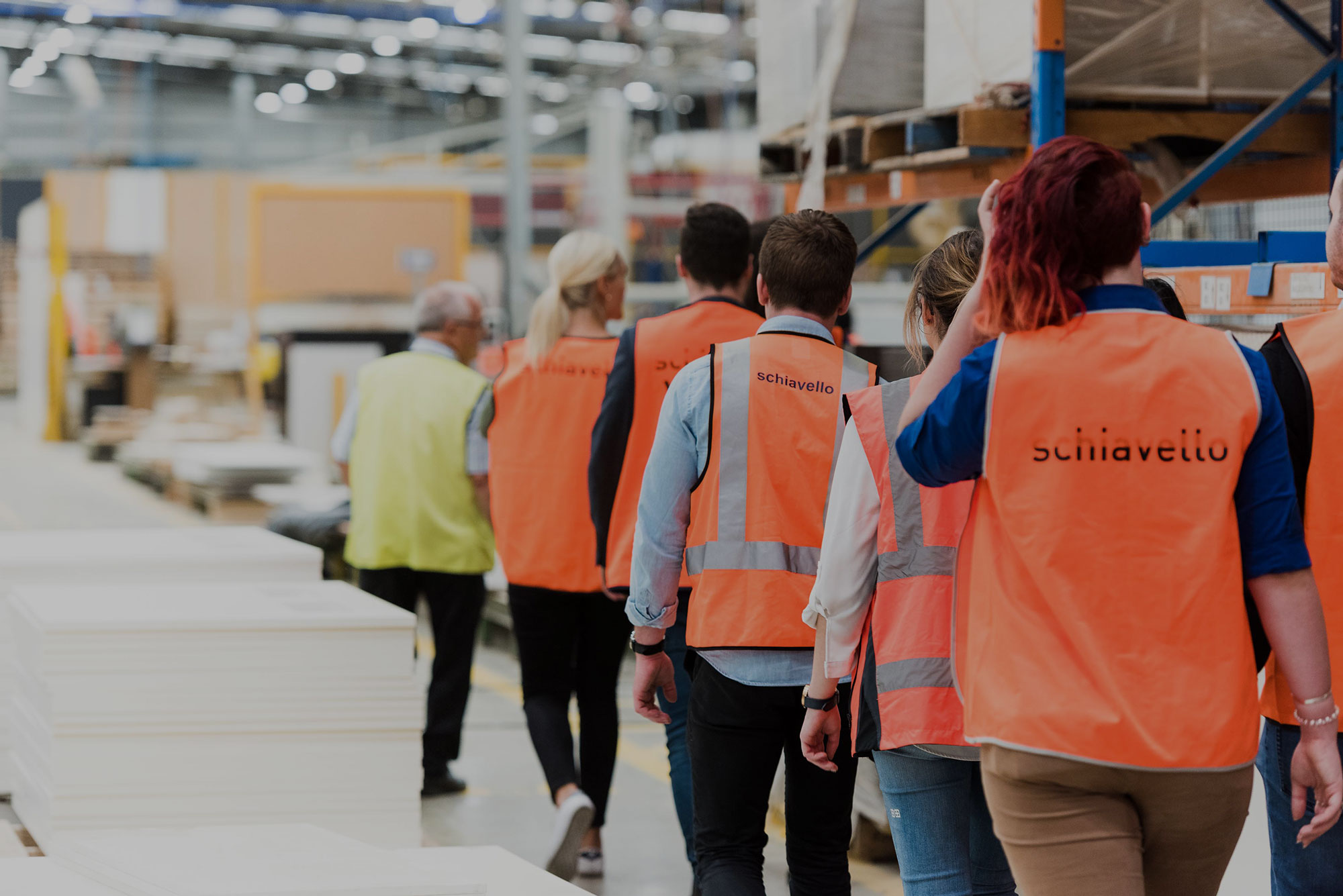 schiavello employees walking in tullamarine factory high visibility vests