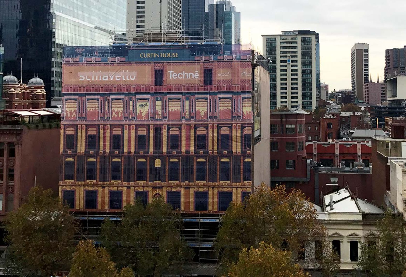 curtin house facade banner on construction site swanston street