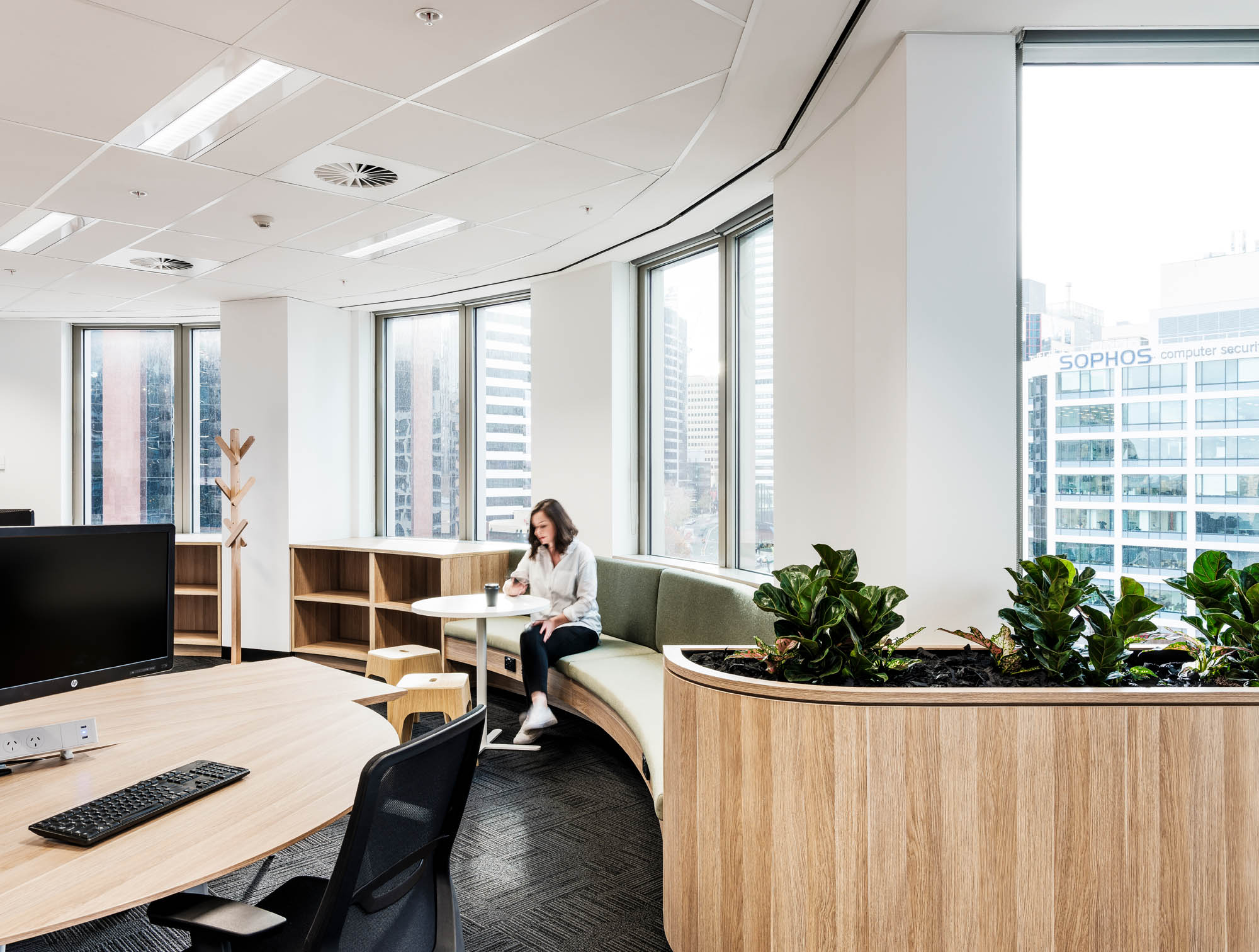 lady sitting in casual work zone at broadspectrum office in sydney 