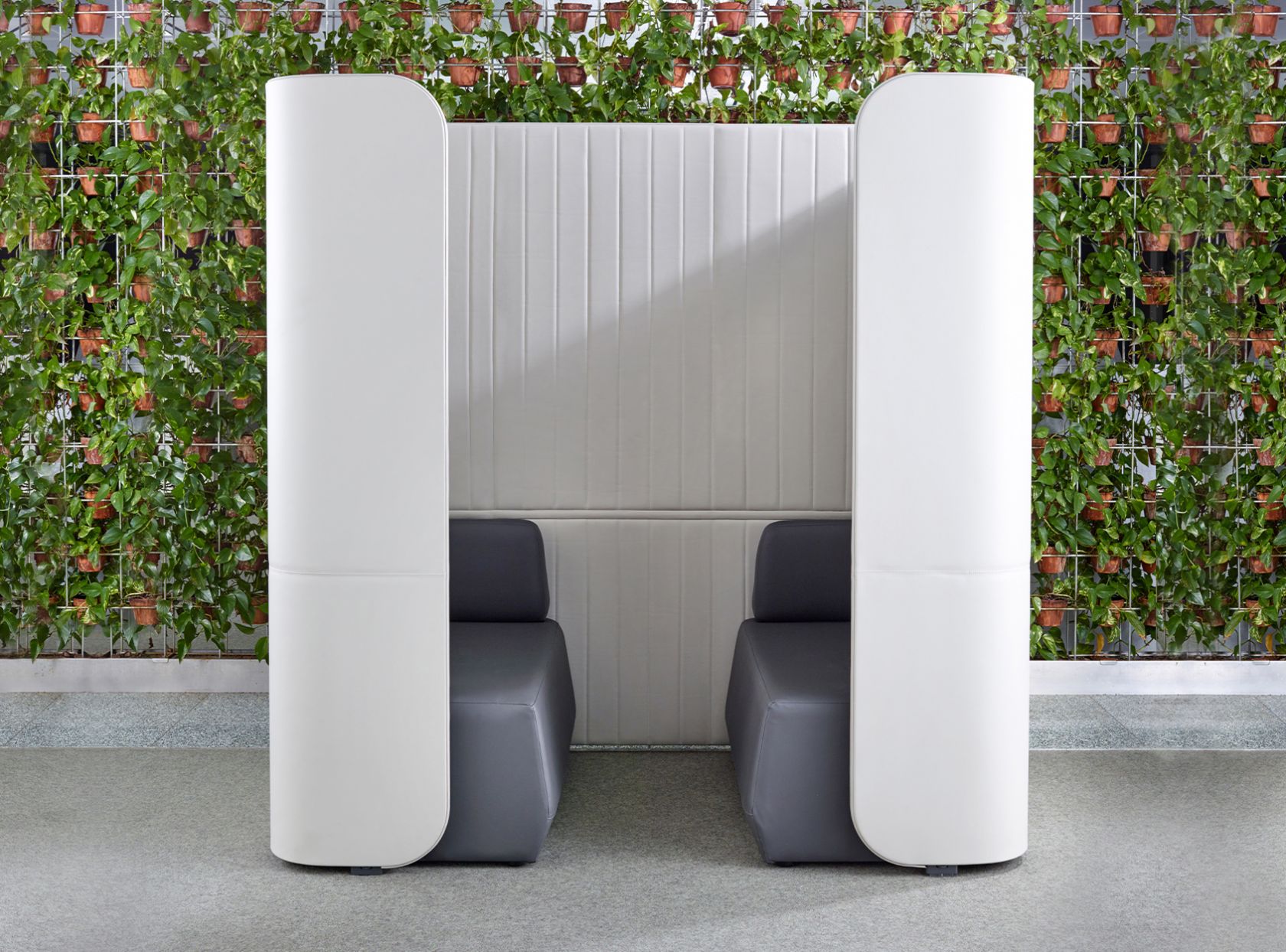 grey focus schiavello furniture booth with vertical garden 