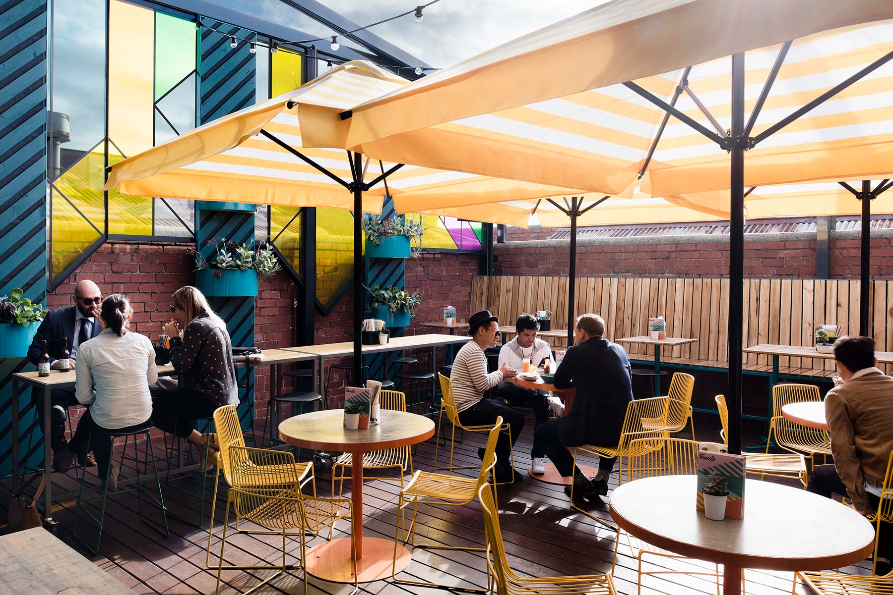 map furniture yellow wire chairs in fonda restaurant outdoor seating