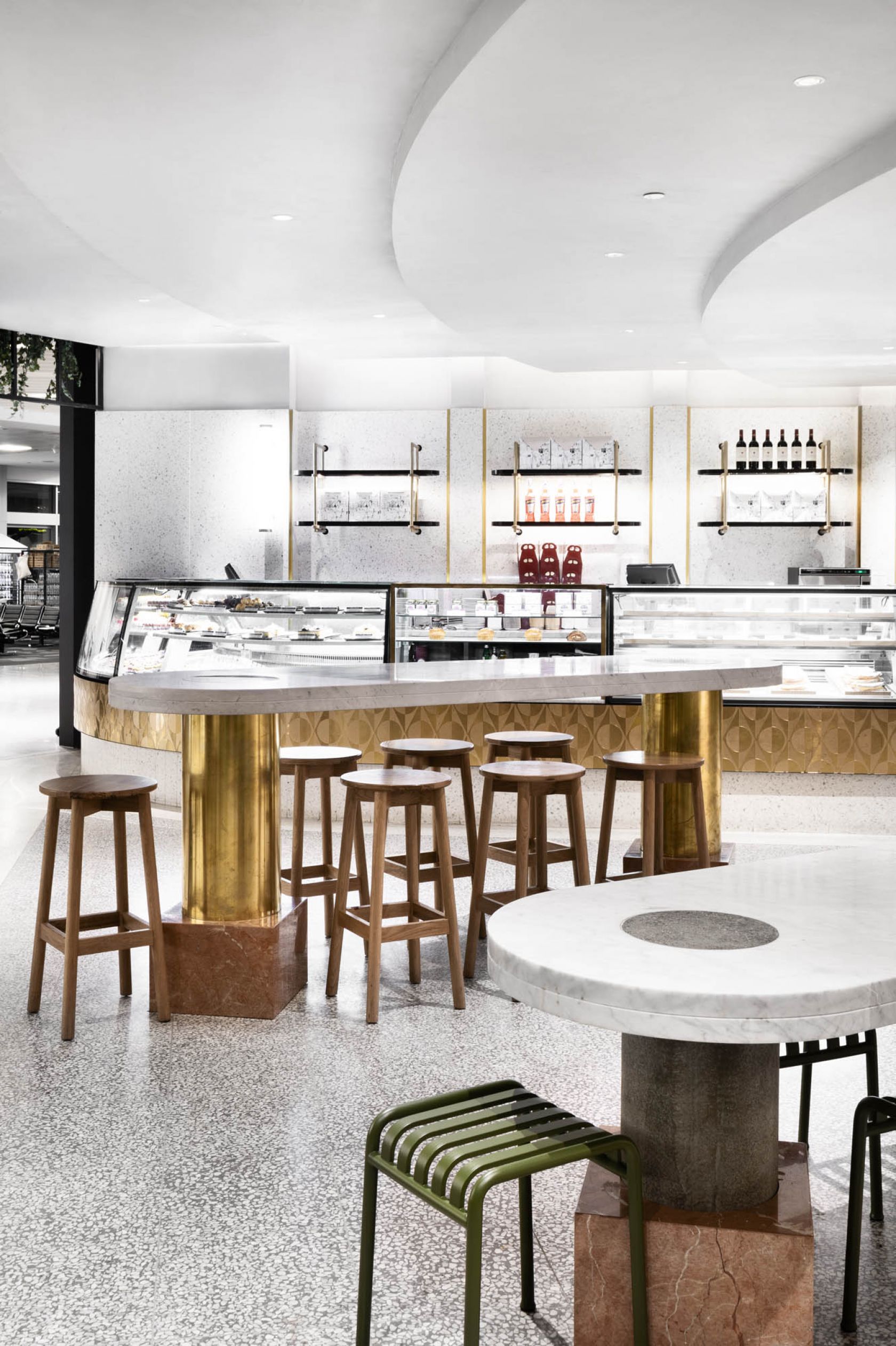 brunetti t2 hospitality interior fitout vic melbourne airport stools tables gold marble benchtop cake dessert display