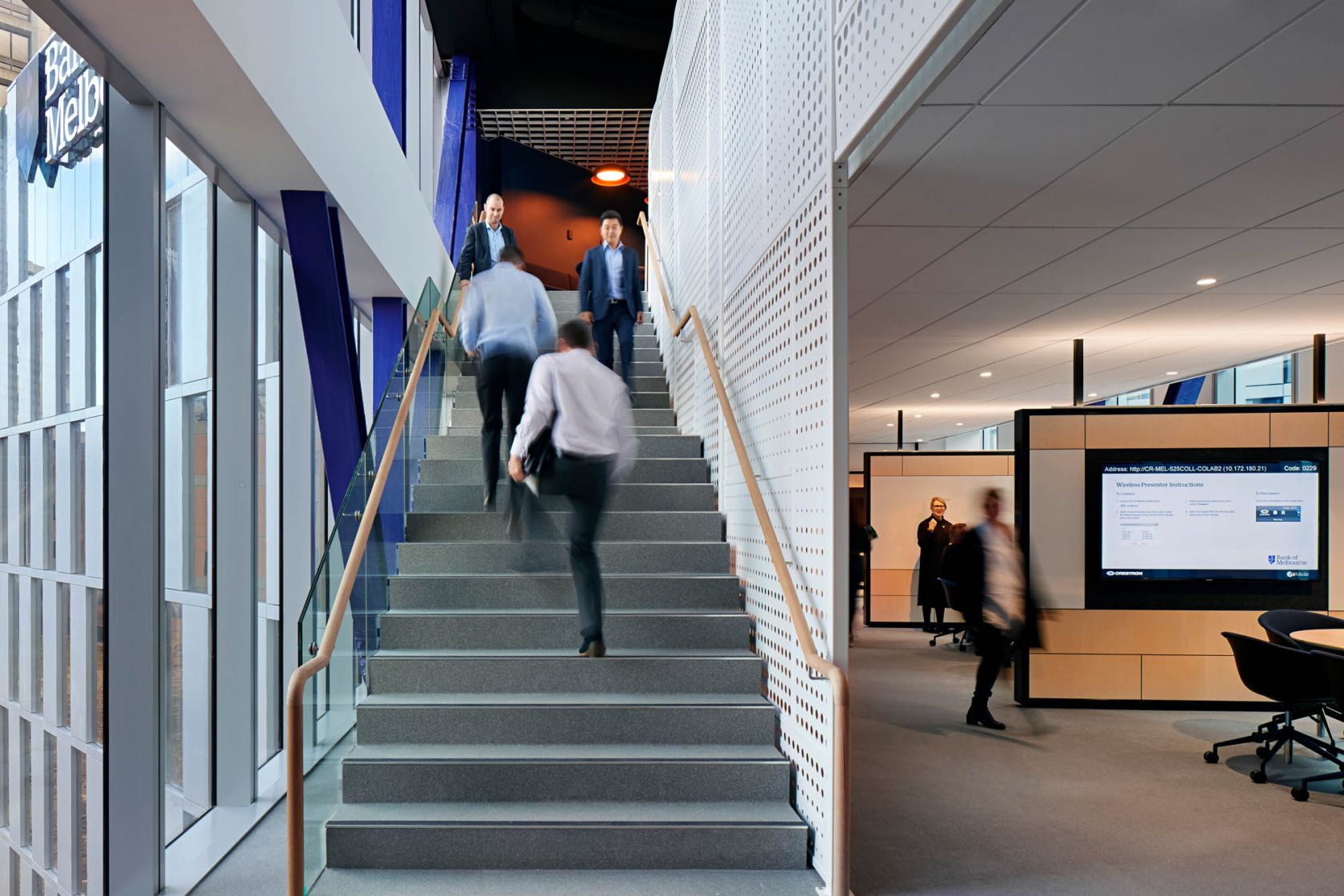 bank of melbourne office staircase with people walking down