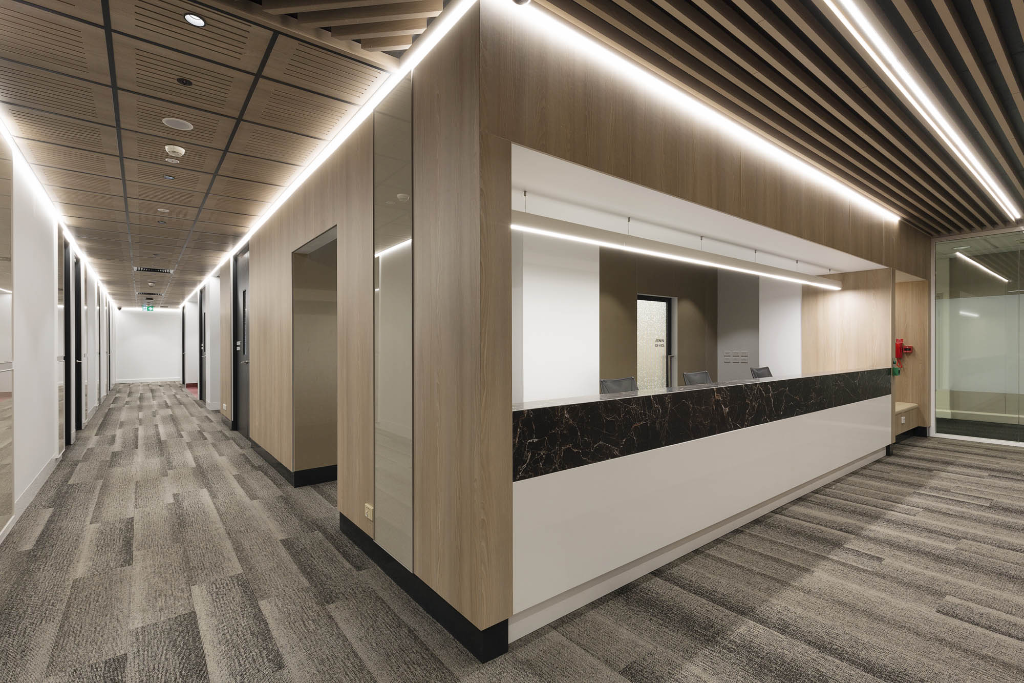 Macquarie Clinic University construction fitout health aged care reception timber recessed lighting