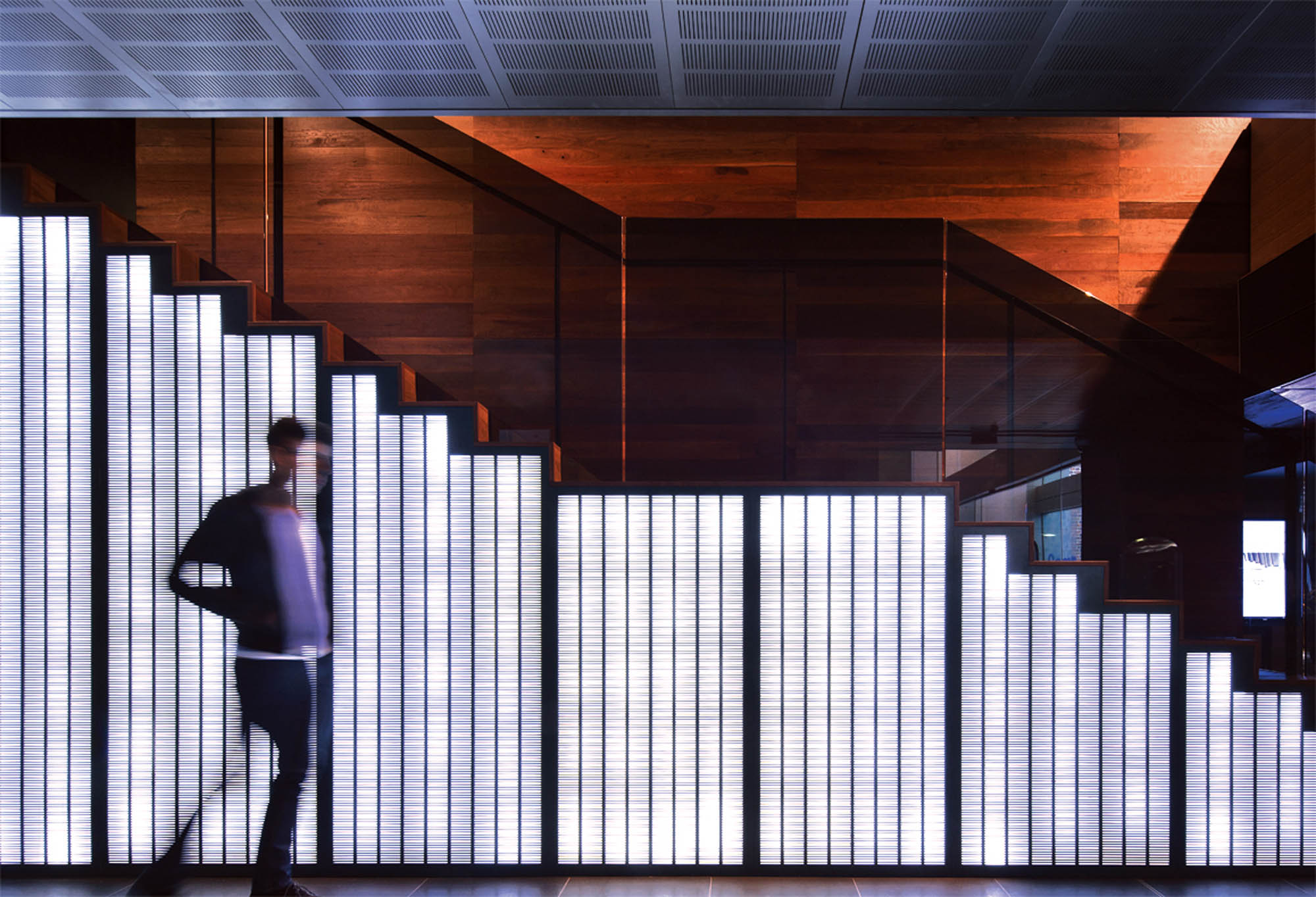 university-of-melbourne-giblin-eunson-library-education-interior-construction-vic-staircase-led-light-black-glass-timber-wood-walls-panels