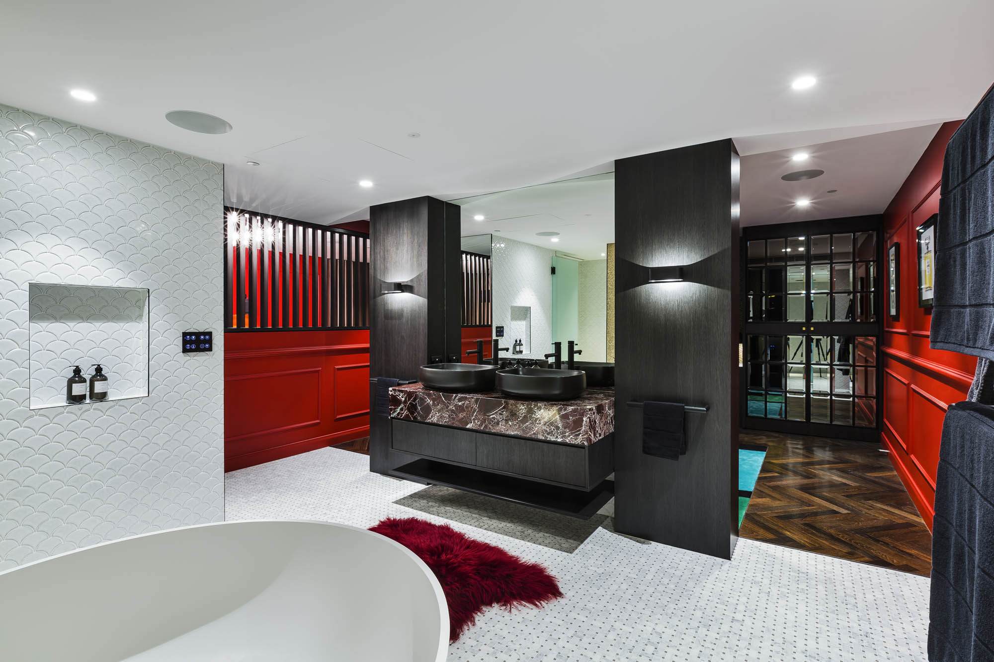 studios at the star sydney hotels design and construct nsw dark romance room suite red walls bathroom white tiles black marble basin red mat bathtub