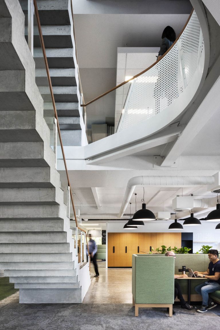 7-Eleven fitout workplace commercial Melbourne stairs concrete glass void 