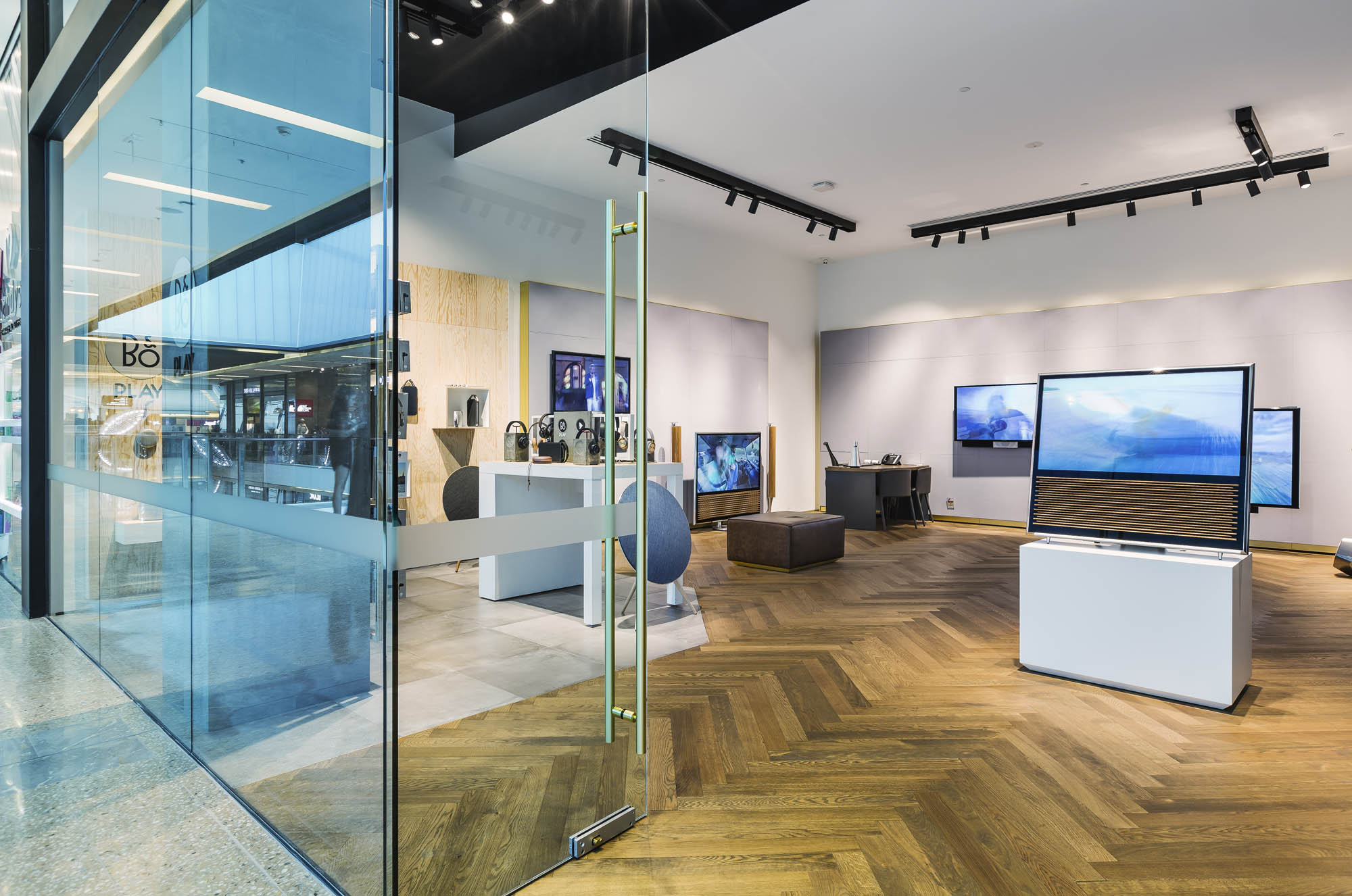 bang and olufsen retail sydney bondi showroom entry doors directional track lighting herringbone floors 