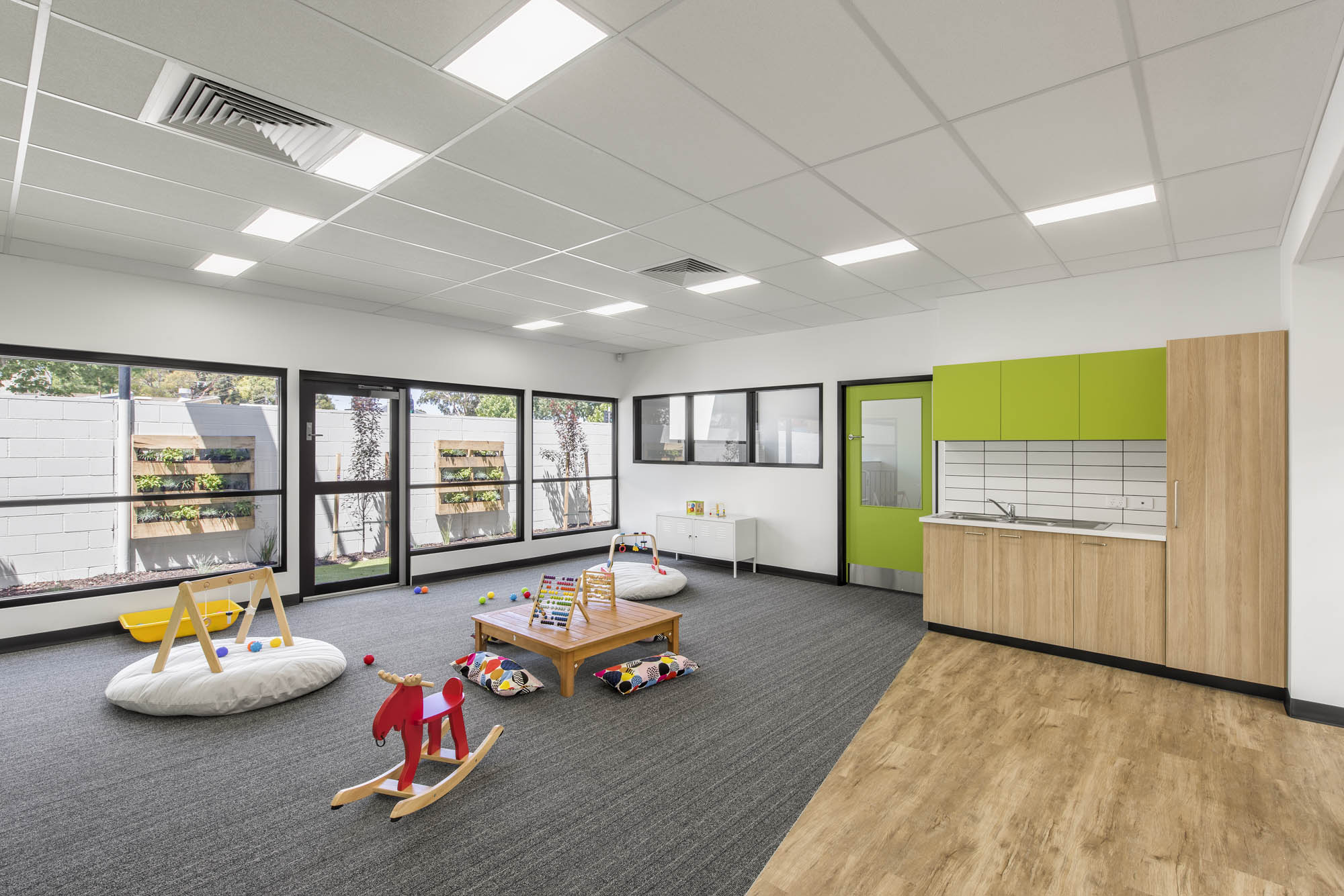 Treetops early learning centre kindergarten fitout adelaide construction education play room vertical garden kitchenette timber flooring carpet