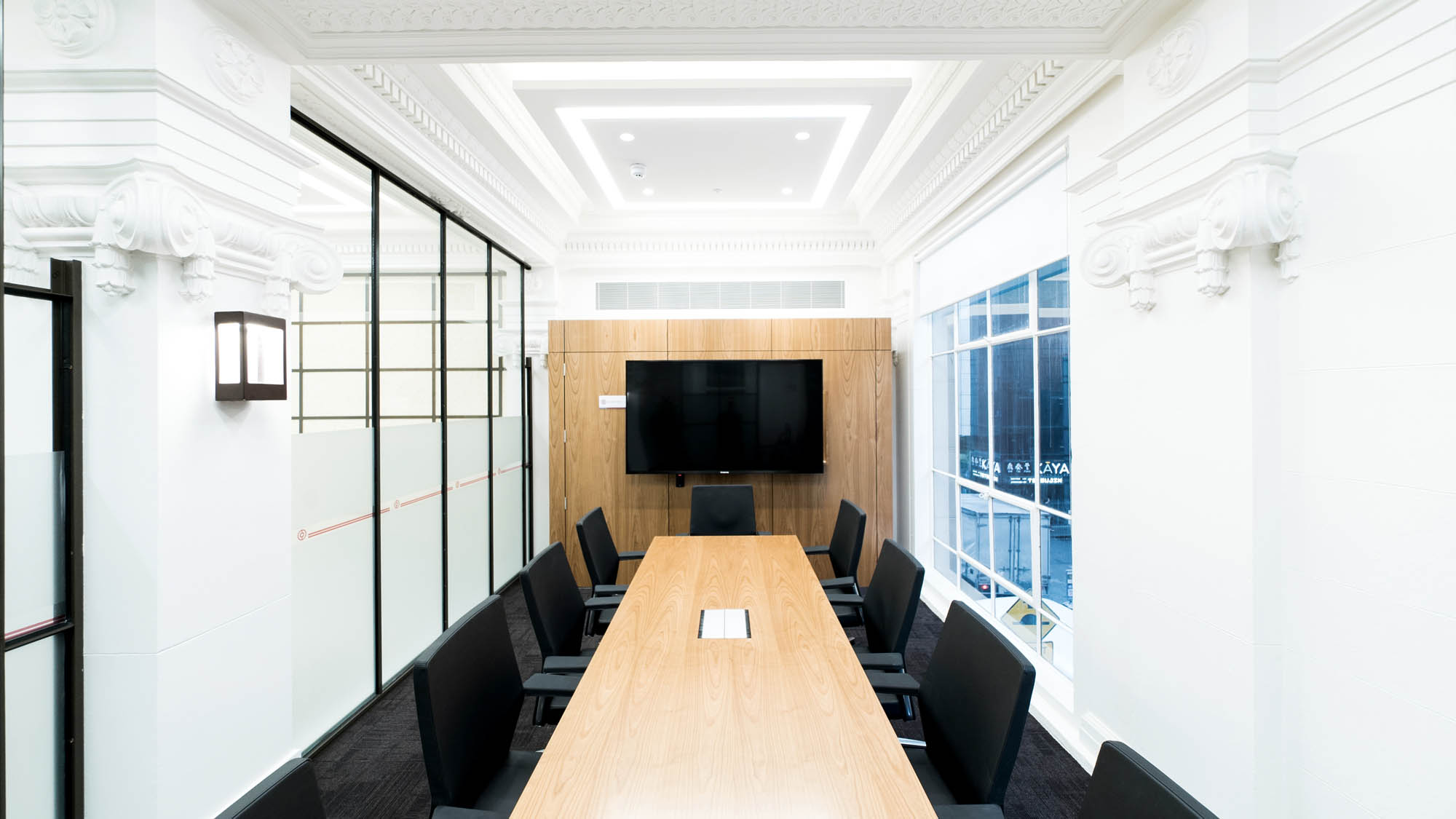 bank of china boardroom table with black office chairs 
