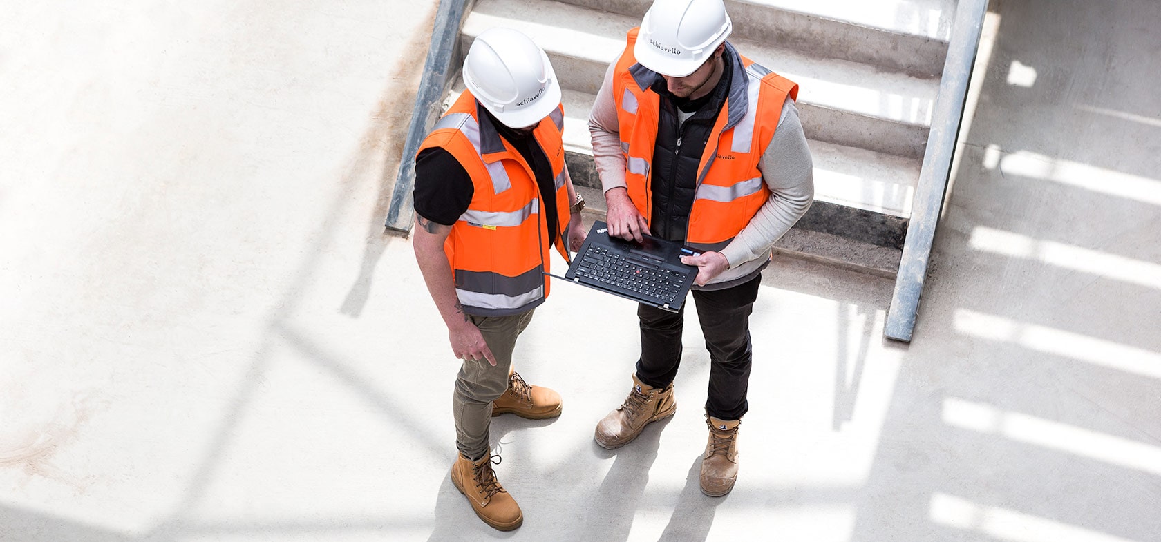 schiavello construction cadet learning onsite with laptop 