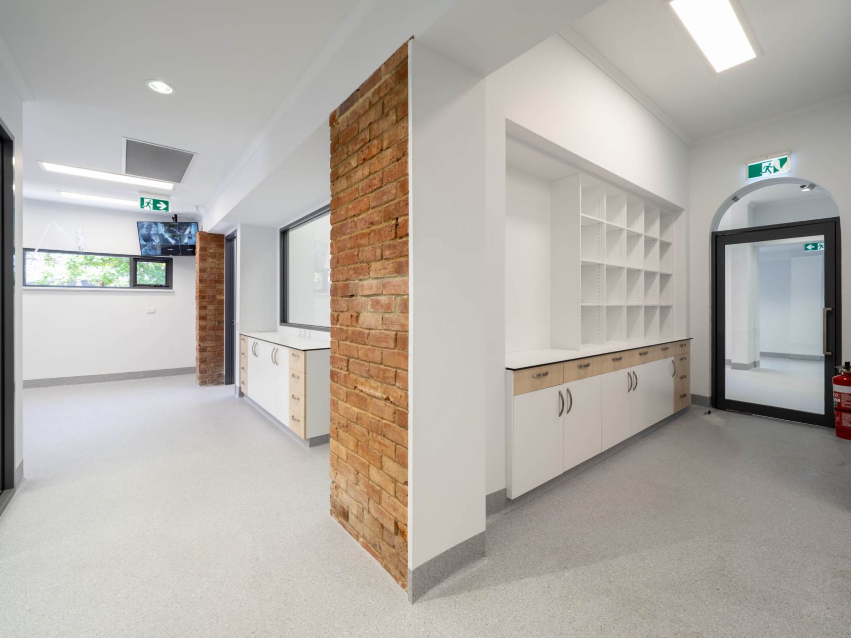 Payneham Veterinary Centre clinic healthcare animal pet construction new build heritage refurbishment adaptive reuse sandstone reception exposed bricks feature timber panelling pendant lighting 