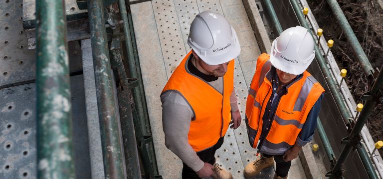 Schiavello Employees Visiting Construction Site Wearing Hard Hats and High Vis Vest