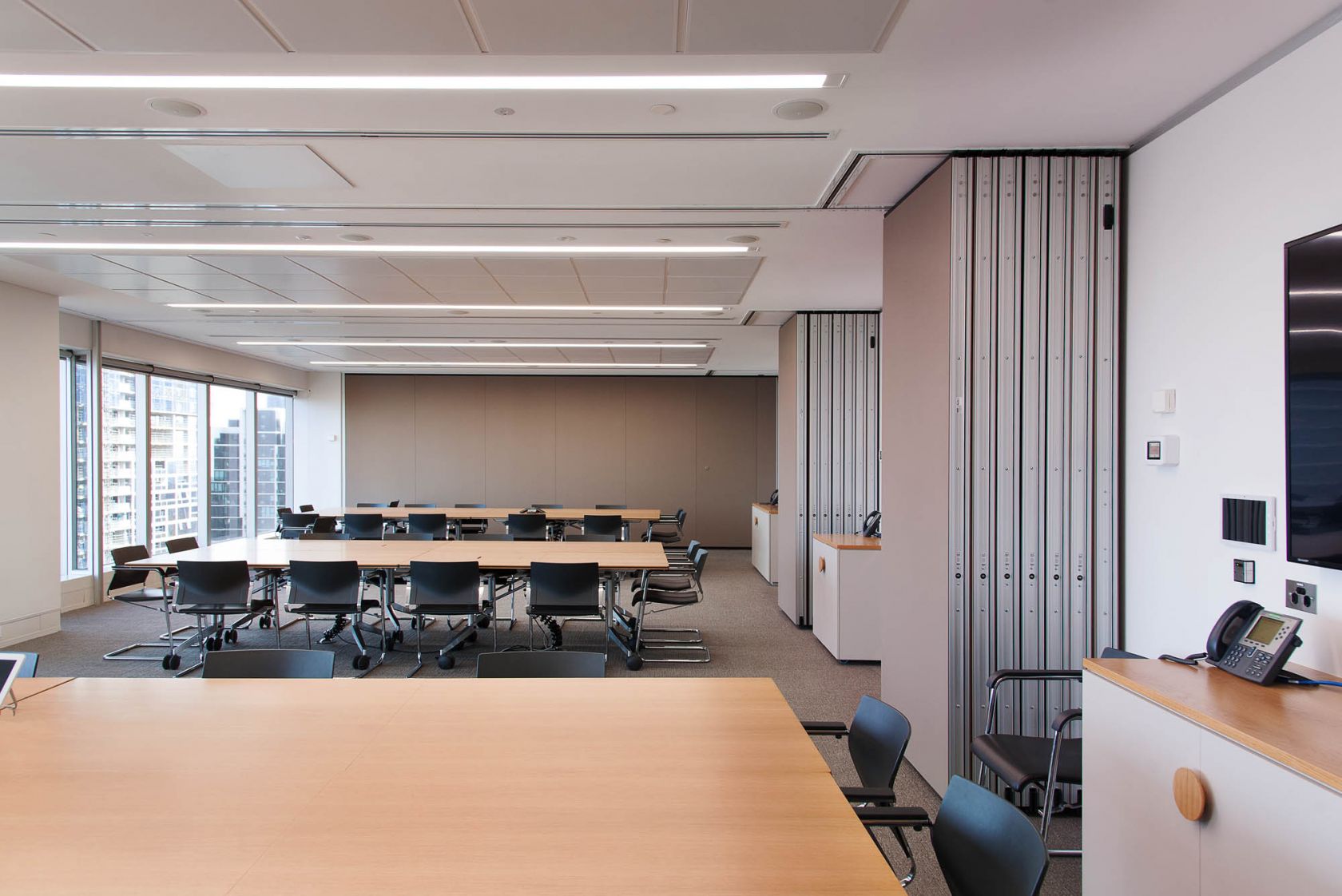 australian government solicitor melbourne office featuring black office chairs and timber tables