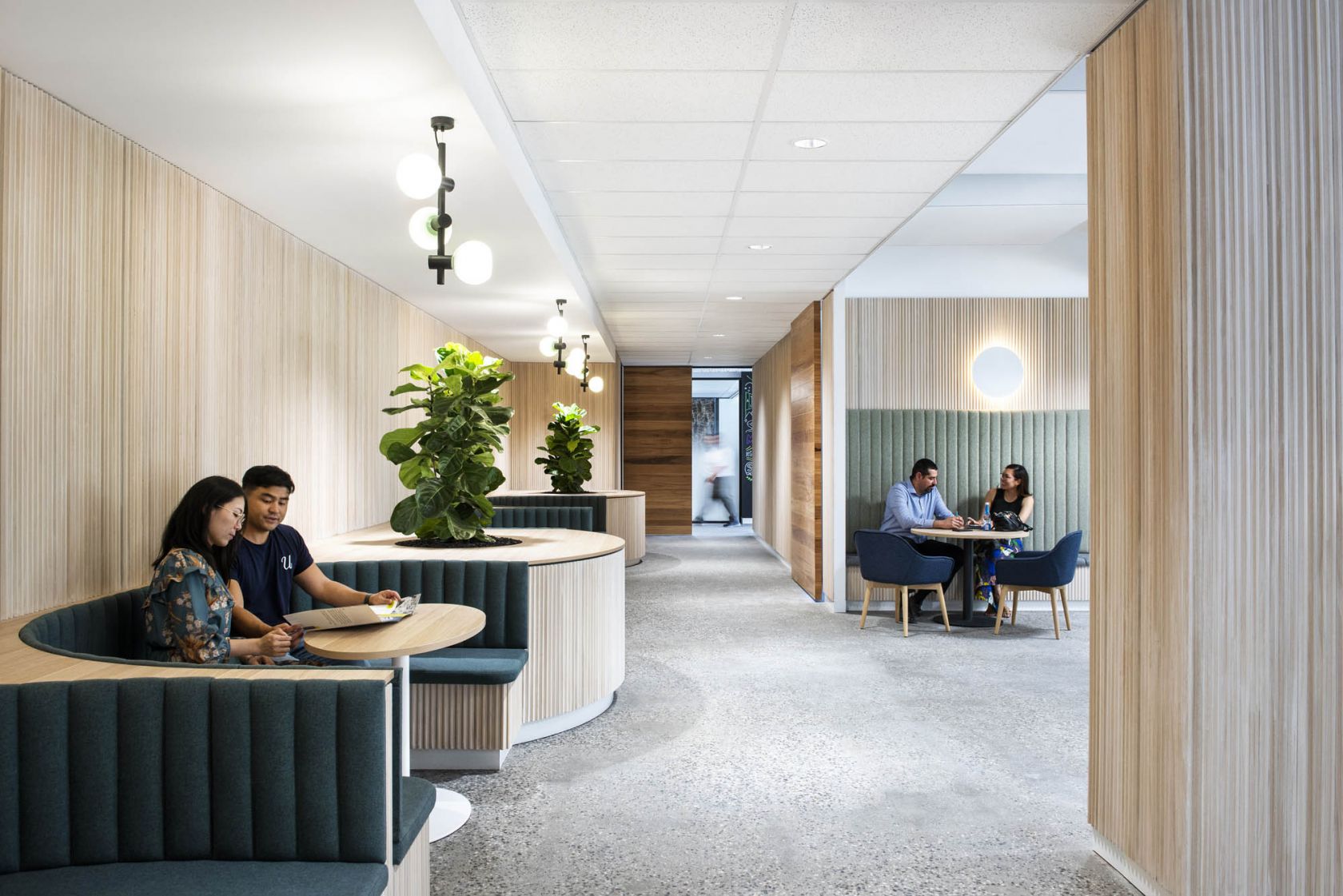 7 Eleven Melbourne commercial workplace fitout collaboration breakout timber curved seating booth pendant lighting polished concrete 