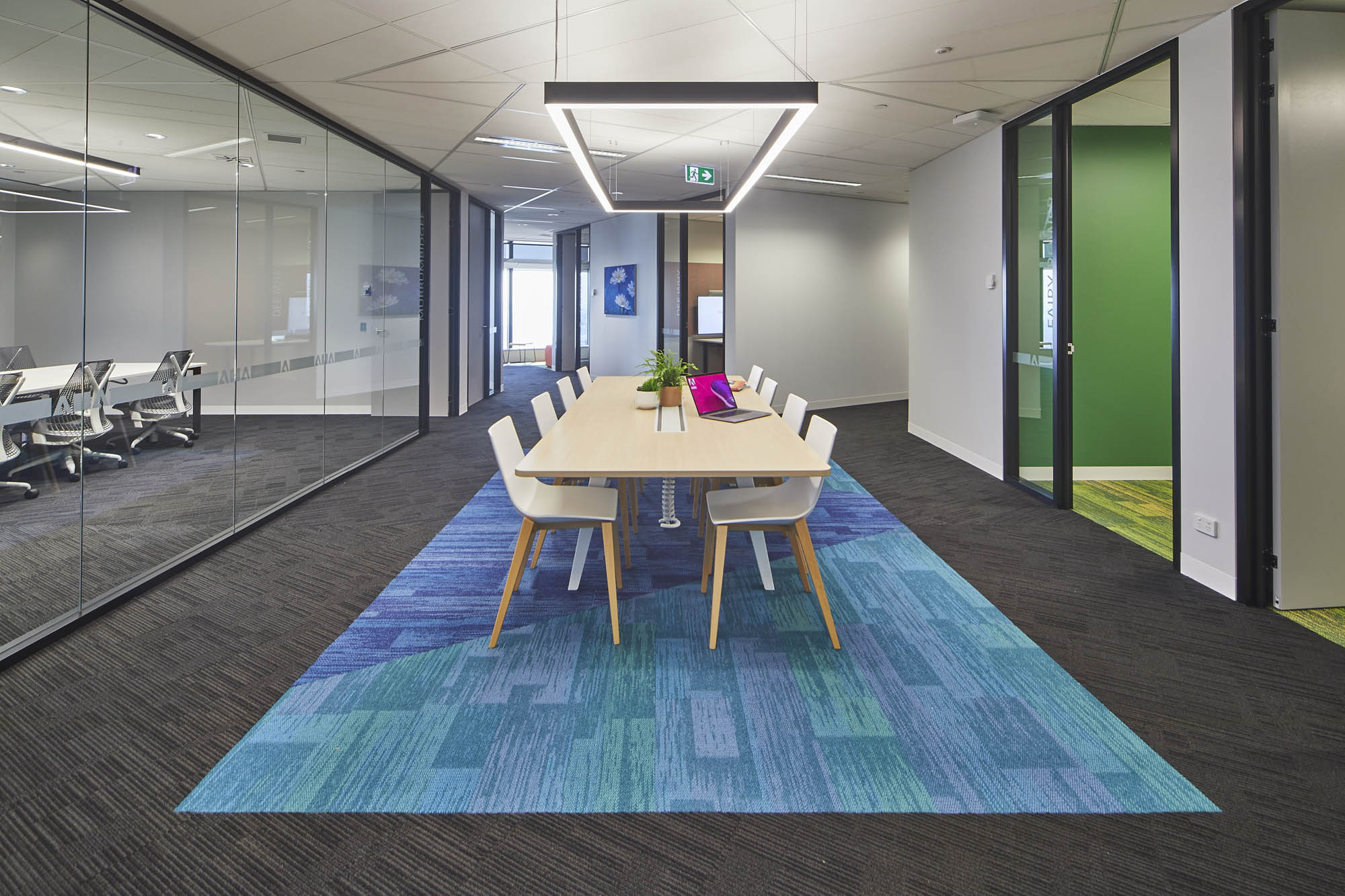 Adobe Head Office Australia Schiavello Fitout Workspace Commercial Office breakout communal workspace casual pendant lights glass glazed meeting room carpet 