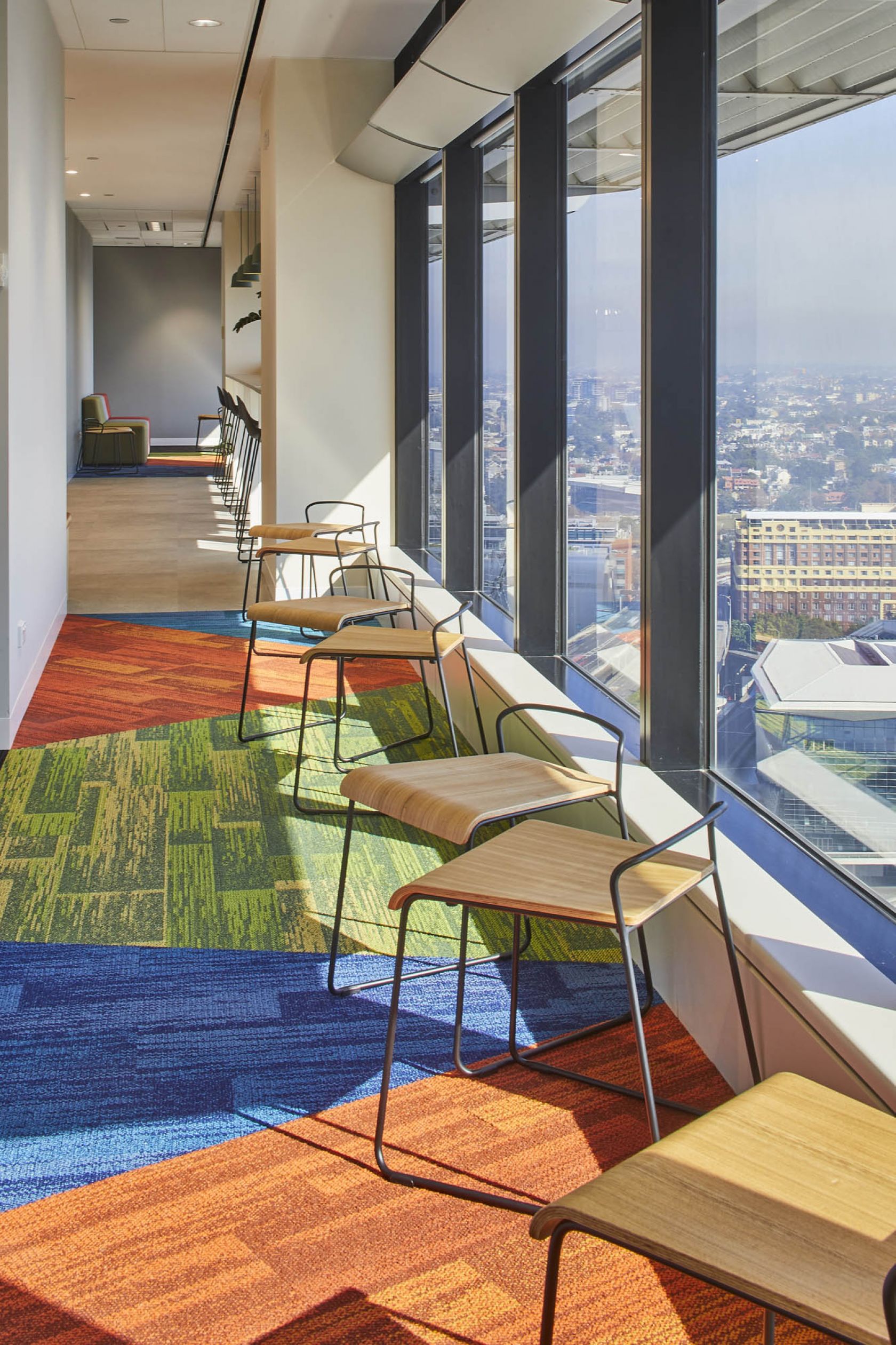 Adobe Head Office Australia Schiavello Fitout Workspace Commercial Office window glass glazing stool seating color colour carpet natural light 